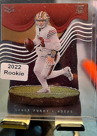 2022 Panini Chronicles Magnitude #MAG-27 Brock Purdy — front