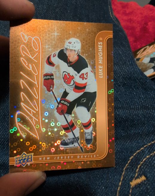 2024-25 Upper Deck Series 2 Orange Dazzlers #DZ-54 Luke Hughes — front