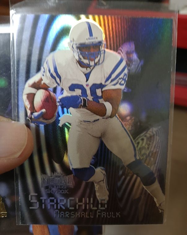 1999 Skybox Metal Universe Starchild #9SC Marshall Faulk — front
