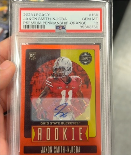 2023 Panini Legacy #166 Jaxon Smith-Njigba Premium Penmanship Orange Rookie Auto — front