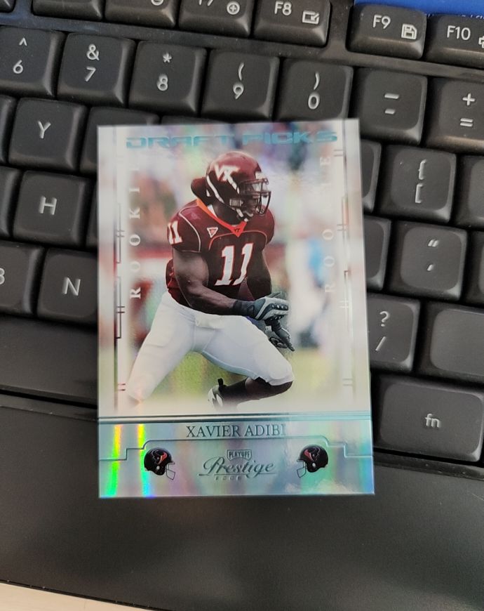 2008 Playoff Prestige Draft Picks Xavier Adibi — front