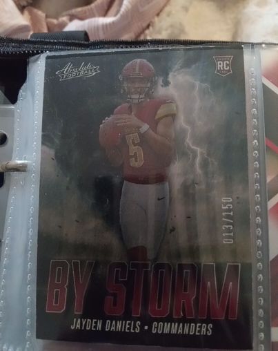 2024 Panini Absolute - By Storm #BS-JDS Jayden Daniels (RC) — front