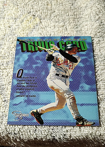 1998 SkyBox Dugout Axcess Trivia Card Q Rafael Palmeiro — front