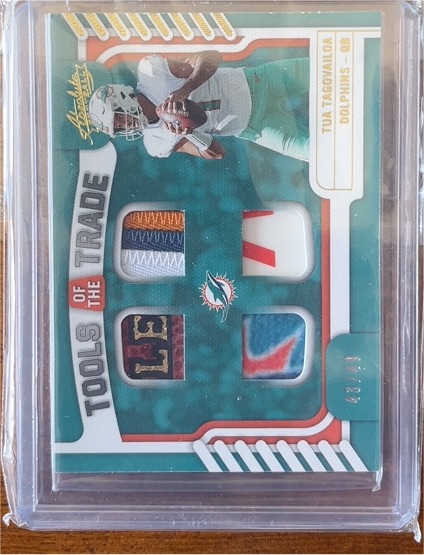 2022 Panini Absolute #TTQ-7 Tua Tagovailoa Tools of the Trade Quad Prime — front