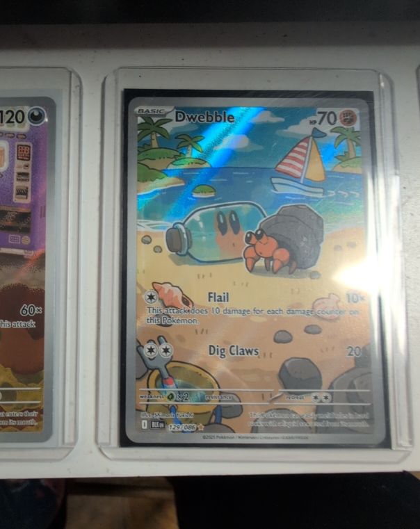 2023 Pokémon #129 Dwebble — front