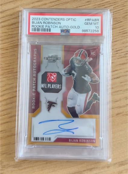 2023 Contenders Optic #RPA-BR Bijan Robinson Rookie Patch Auto-Gold — front