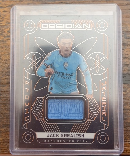 2022 Panini Obsidian Atomic Material #AM-JG Jack Grealish — front