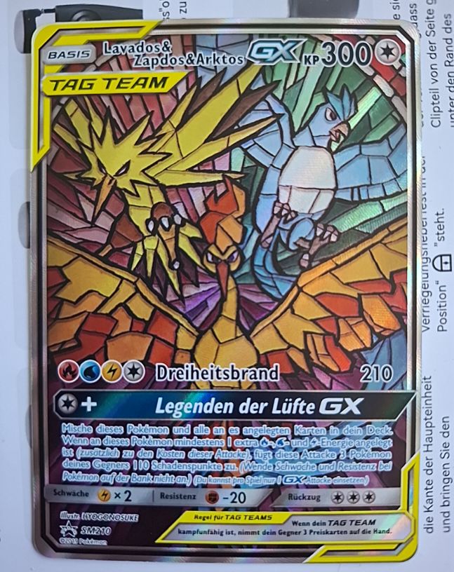 2019 Pokémon SM Promos #SM210 Lavados & Zapdos & Arktos GX — front