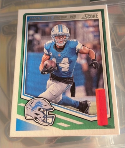 2025 Panini Score #142 Amon-Ra St. Brown — front