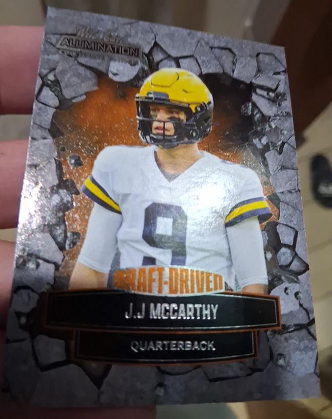 2021 Wild Card Alumination NIL #ANDD-18 J.J. McCarthy Draft-Driven Orange — front