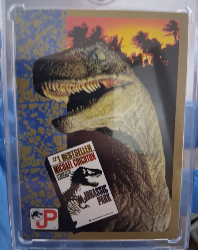 1993 Topps Jurassic Park #71 The Novel By Michael Crichton — front