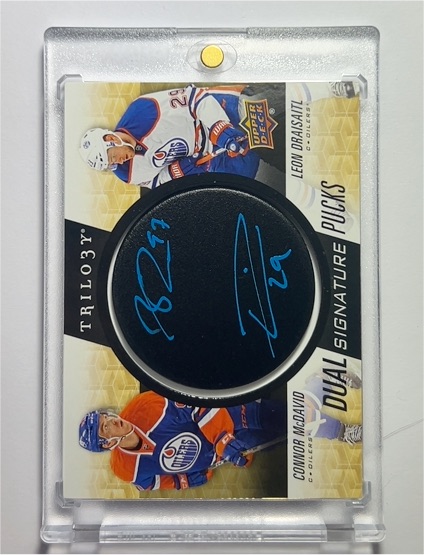 2019-20 Upper Deck Trilogy Dual Signature Pucks Connor McDavid & Leon Draisaitl — front