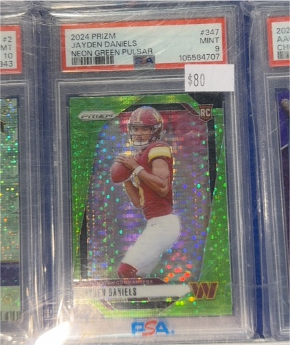 2024 Panini Prizm #347 Jayden Daniels Neon Green Pulsar Rookie Card — front