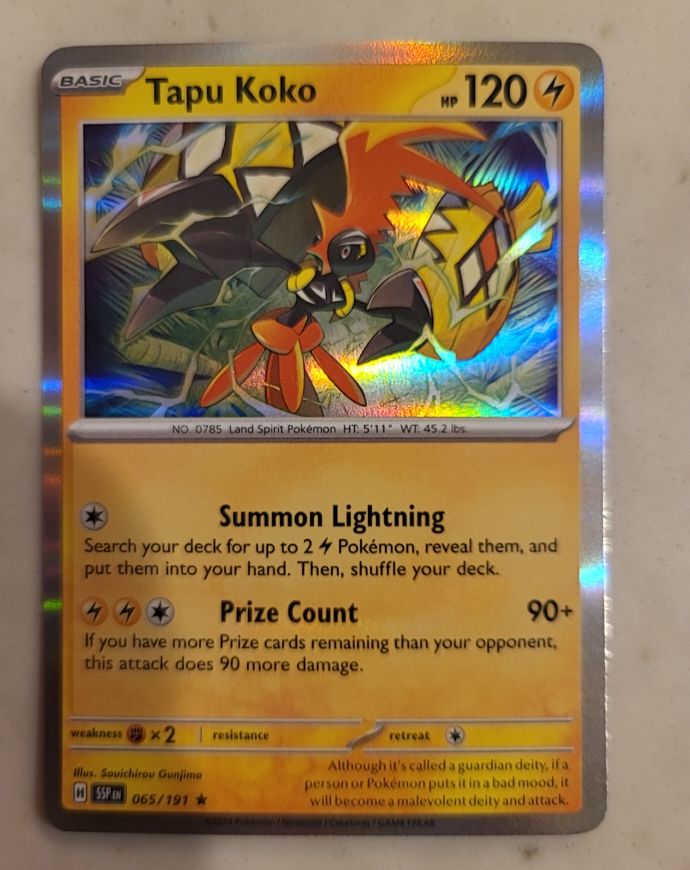 2022 Pokémon SV08: Surging Sparks #065 Tapu Koko — front