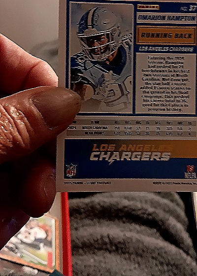 2023 Panini Score #37 Omarion Hampton — back