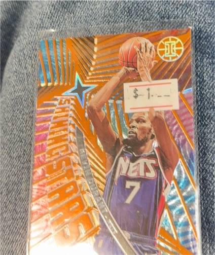 2021-22 Panini Illusions #7 Donovan Mitchell Shining Stars Orange — front