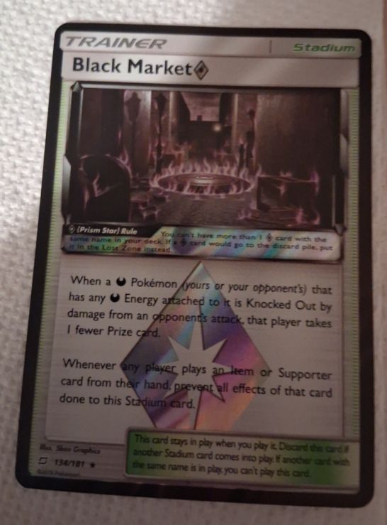2019 Pokémon Sun & Moon Team Up #134 Black Market Prism Star — front