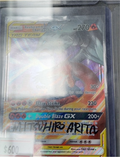 2019 Pokémon TCG Sun & Moon Unbroken Bonds #20/214 Reshiram & Charizard GX — front
