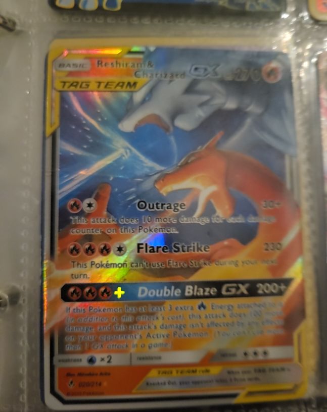 2019 Pokémon TCG Sun & Moon Unbroken Bonds #20/214 Reshiram & Charizard GX — front