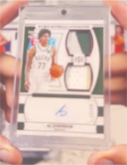 2024-25 Panini National Treasures #99 AJ Johnson Rookie Materials Auto — front