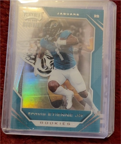 2021 Panini Chronicles Playoff Momentum #PMR-12 Travis Etienne Jr — front