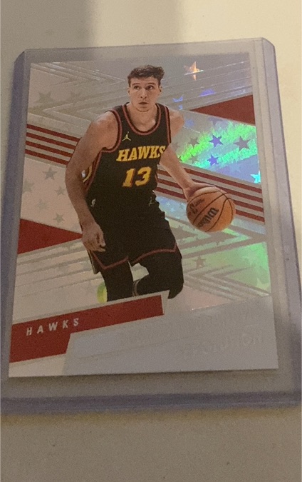 2024-25 Panini Revolution #13 Trae Young — front