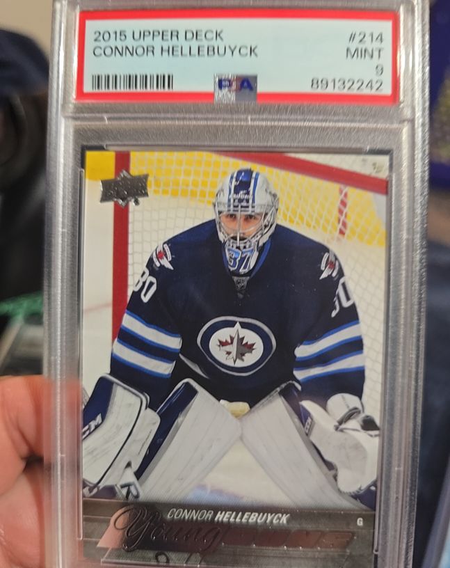 2015 Upper Deck #214 Connor Hellebuyck Young Guns Rookie — front