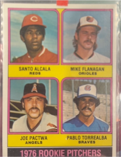 1976 Topps #589 Rookie Pitchers Santo Alcala / Mike Flanagan / Joe Pactwa / Pablo Torrealba — front