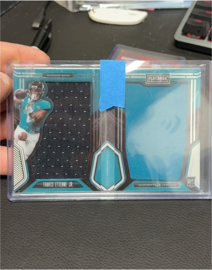 2021 Panini Playbook Rookie Jumbo Memorabilia Booklet #RJM-TEJ Travis Etienne Jr. — front