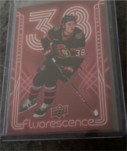 2024-25 Upper Deck Series 2 Fluorescence Red #F-3 Zack Ostapchuk — front