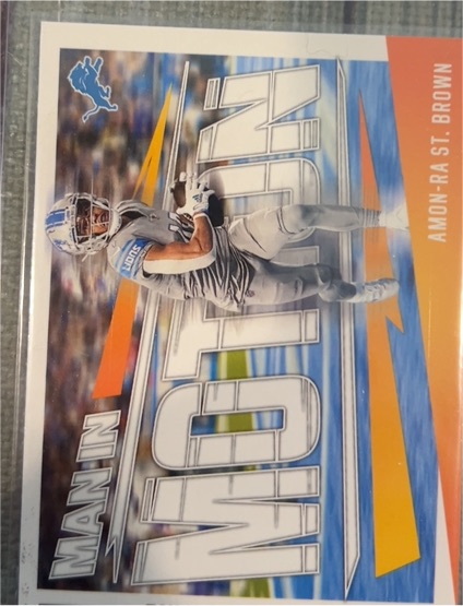 2023 Panini Rookies & Stars #MM-1 Amon-Ra St. Brown Man In Motion — front