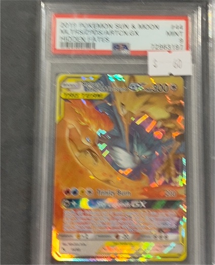 2019 Pokemon Sun & Moon Unbroken Bonds #20/214 Reshiram & Charizard GX — front