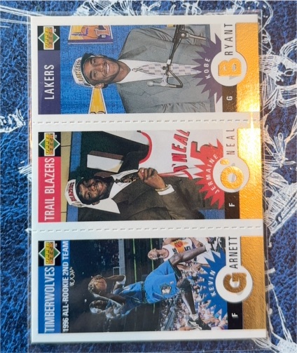 1996-97 Upper Deck Collector's Choice #M129 Kobe Bryant / Jermaine O'Neal / Kevin Garnett — front