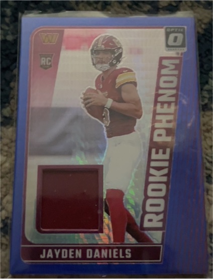 2024 Panini Donruss Optic #RPB-JDS Jayden Daniels Rookie Phenom Blue Hyper Patch — front