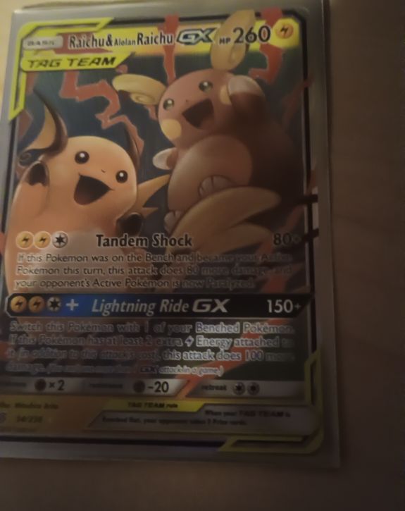 2019 Pokémon Unified Minds #54 Raichu & Alolan Raichu GX — front