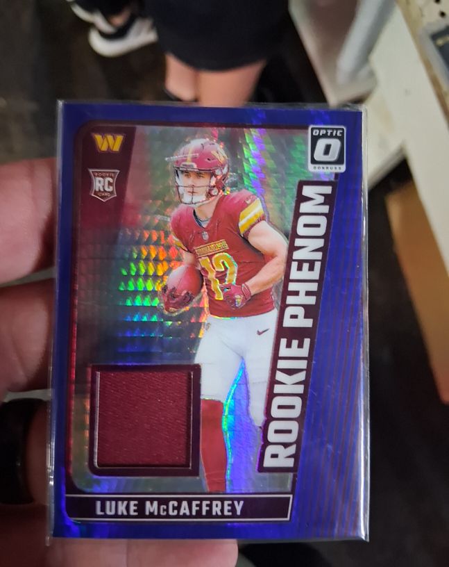 2024 Panini Donruss Optic #RPB-LMC Luke McCaffrey Rookie Phenom Blue Hyper Patch — front