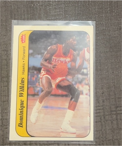 1986 Fleer Sticker #11 Dominique Wilkins — front