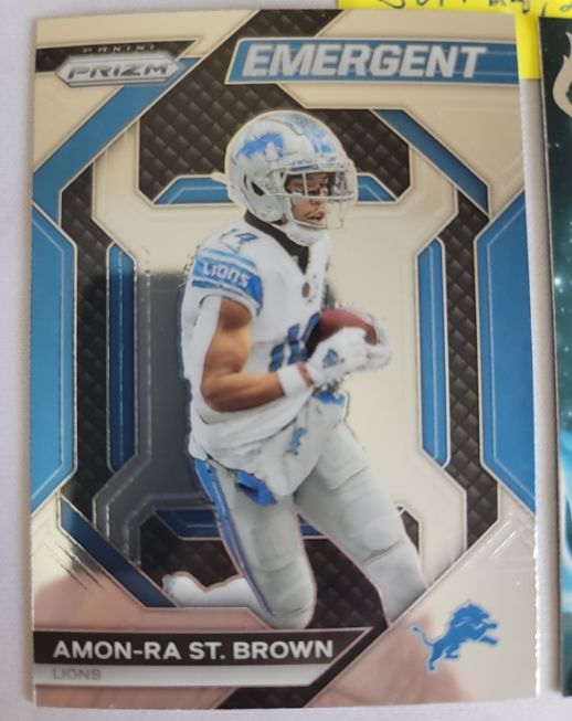 2023 Panini Prizm Emergent #H-8 Amon-Ra St. Brown — front