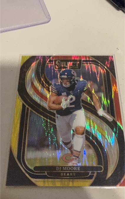 2024 Panini Select Premier Level Red and Yellow Shock Prizm #151 DJ Moore — front