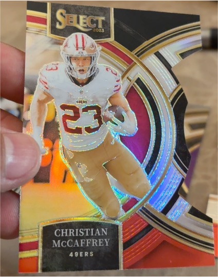 2023 Panini Select #145 Christian McCaffrey Red and Yellow Prizms Die Cuts — front