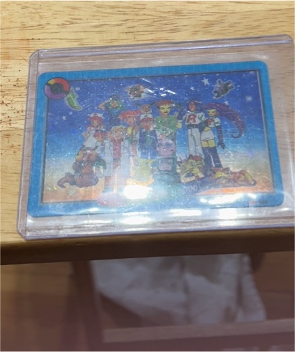 1990 Pokémon Team Rocket and Pokémon Holographic Card — front