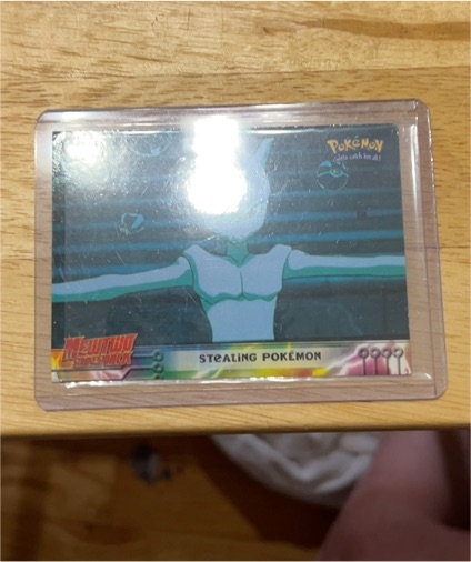 1999 Topps Mewtwo Strikes Back #27 Stealing Pokemon — front