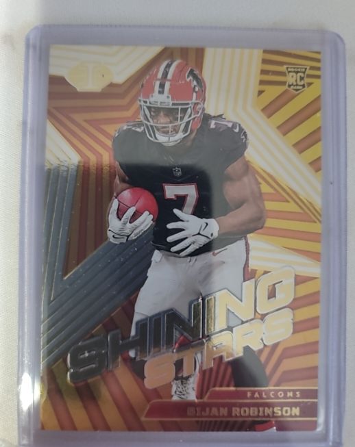 2023 Panini Illusions Shining Stars #17 Bijan Robinson — front