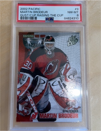 2002 Pacific #9 Martin Brodeur Raising The Cup — front