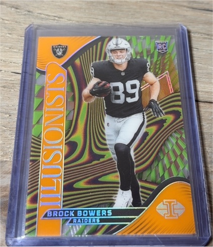 2024 Panini Illusions #7 Brock Bowers Illusionists Orange Parallel Rookie — front