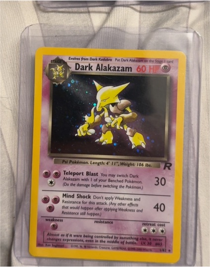 2000 Team Rocket #1 Dark Alakazam — front
