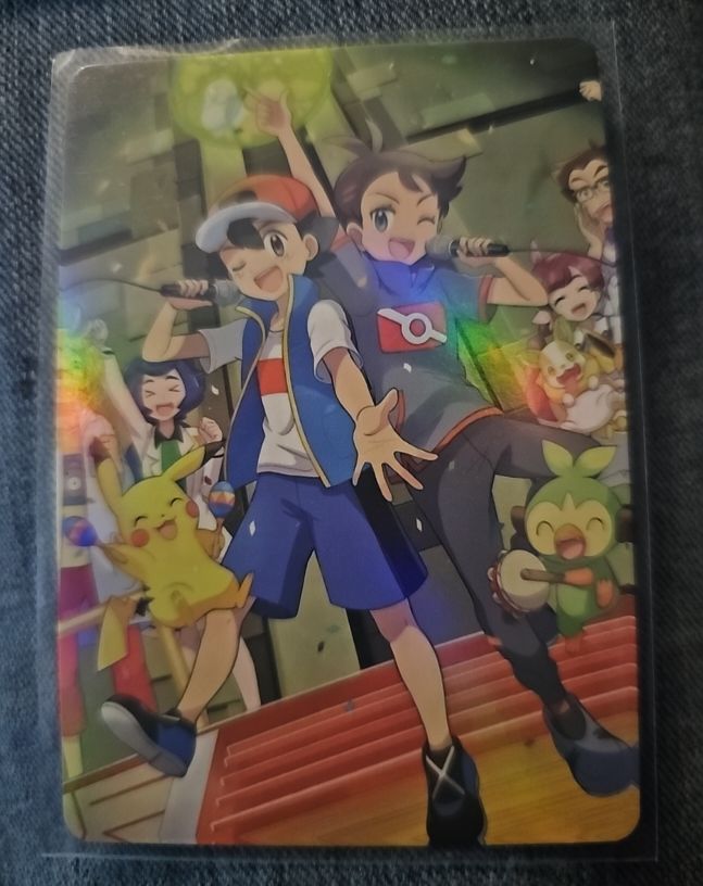 2023 Pokémon Ash Ketchum & Goh Holo Promo Card — front