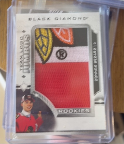 2023-24 Upper Deck Black Diamond #RTL-CB Connor Bedard Rookie Team Logo Jumbo Patch — front