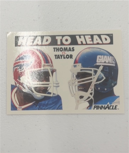 1991 Pinnacle #354 Thurman Thomas vs. Lawrence Taylor — front