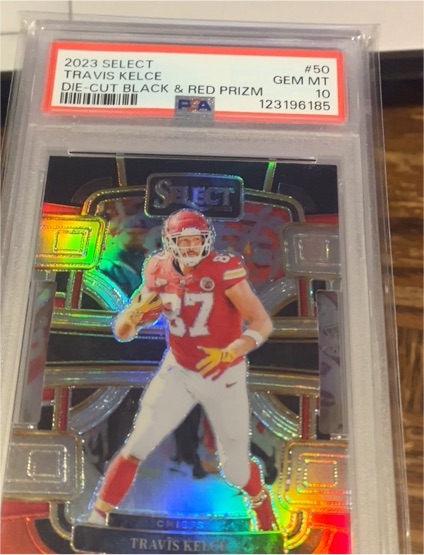 2023 Panini Select #50 Travis Kelce Die-Cut Black & Red Prizm — front